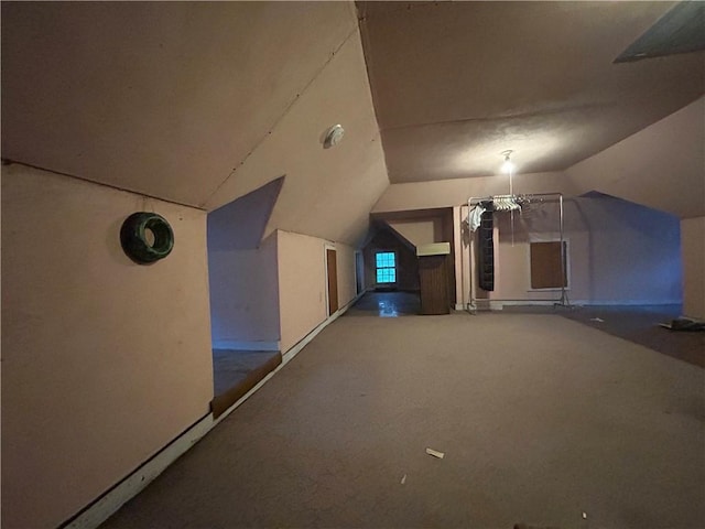 additional living space with lofted ceiling, carpet, and baseboards