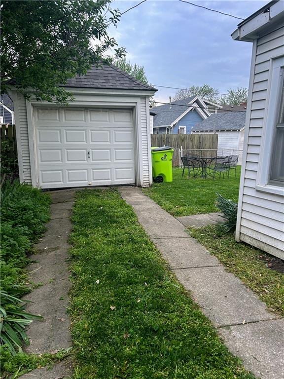 detached garage featuring driveway