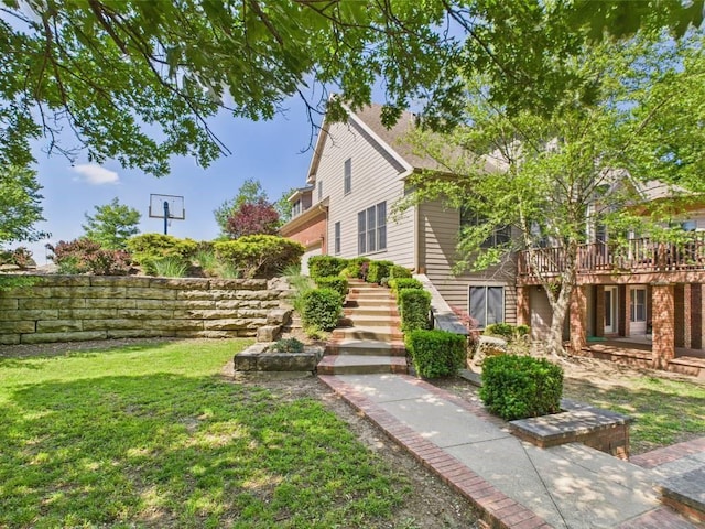 1051 205th St, Fort Scott, KS 66701 - view of grassy yard featuring stairs and a wooden deck