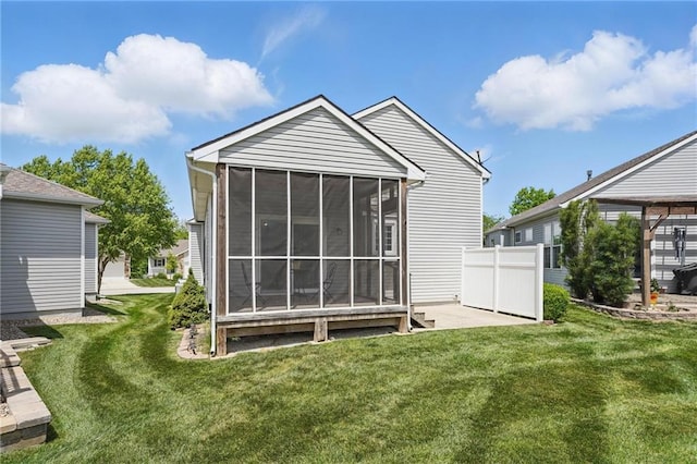 1605 NW Primrose Ln, Blue Springs, MO 64015 - back of house with a sunroom