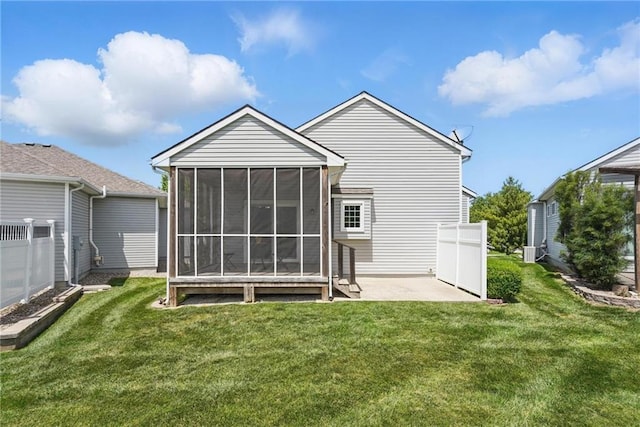 1605 NW Primrose Ln, Blue Springs, MO 64015 - rear view of house with a sunroom and a patio area