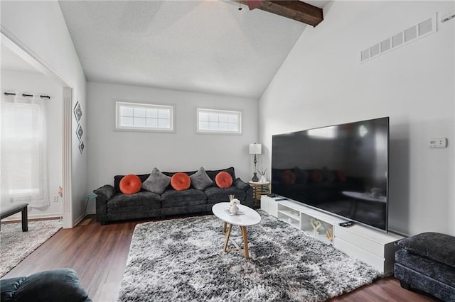 1605 NW Primrose Ln, Blue Springs, MO 64015 - living room featuring wood finished floors, beamed ceiling, and high vaulted ceiling
