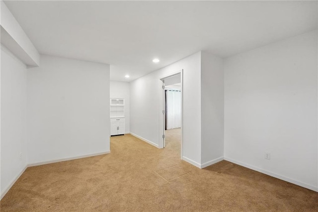1605 NW Primrose Ln, Blue Springs, MO 64015 - empty room with light carpet and recessed lighting