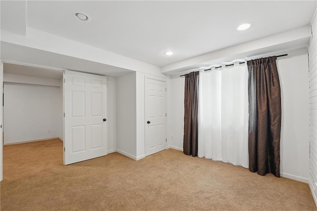 1605 NW Primrose Ln, Blue Springs, MO 64015 - unfurnished bedroom with light carpet and recessed lighting