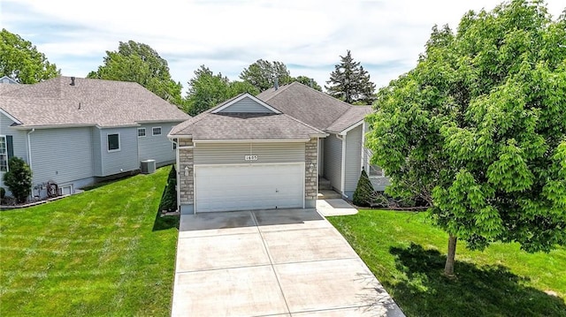 1605 NW Primrose Ln, Blue Springs, MO 64015 - view of front of house with driveway, a front lawn, an attached garage, and stone siding