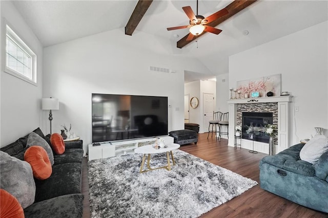 1605 NW Primrose Ln, Blue Springs, MO 64015 - living area with wood finished floors, a ceiling fan, and a tile fireplace