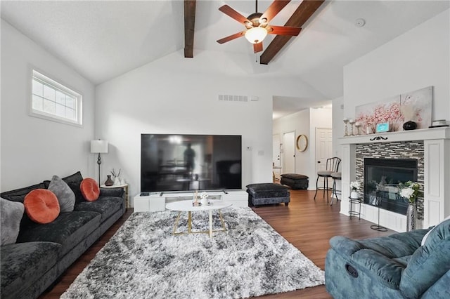 1605 NW Primrose Ln, Blue Springs, MO 64015 - living area featuring dark wood finished floors, a ceiling fan, and a tile fireplace