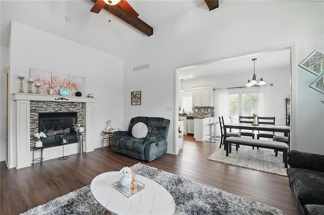 1605 NW Primrose Ln, Blue Springs, MO 64015 - living area with ceiling fan, wood finished floors, a chandelier, and a tiled fireplace