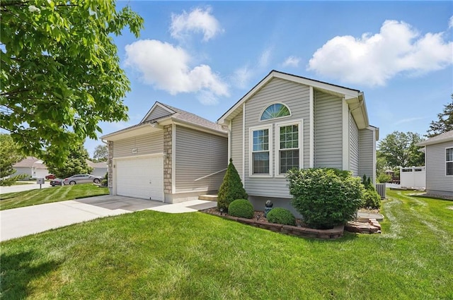 1605 NW Primrose Ln, Blue Springs, MO 64015 - view of front facade with a front yard, concrete driveway, and a garage
