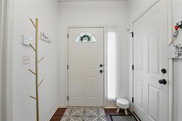 1605 NW Primrose Ln, Blue Springs, MO 64015 - foyer entrance with dark wood-style floors and baseboards