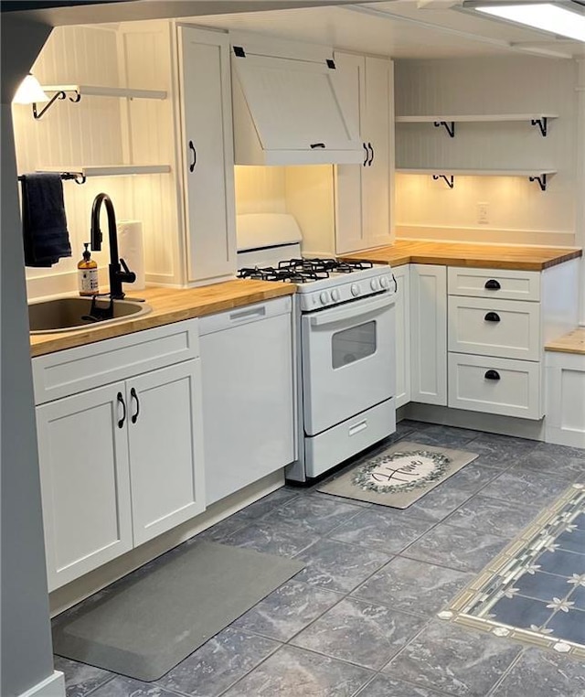 1808 Bellevue St, Saint Joseph, MO 64505 - kitchen featuring white appliances, wood counters, a sink, open shelves, and white cabinets