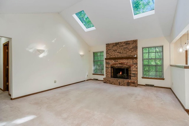 5004 S Kendall Dr, Independence, MO 64055 - unfurnished living room with a skylight, high vaulted ceiling, plenty of natural light, and carpet floors