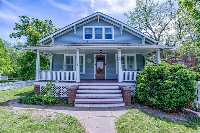 907 W 6th St, Lawrence, KS 66044 - bungalow-style home with covered porch