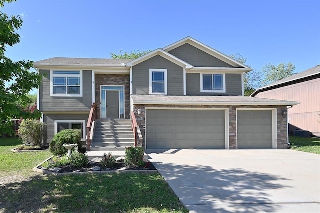 15790 NW 125th St, Platte City, MO 64079 - raised ranch with a garage, driveway, and stone siding