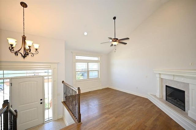 15790 NW 125th St, Platte City, MO 64079 - foyer entrance featuring a chandelier, ceiling fan, lofted ceiling, a high end fireplace, and wood finished floors