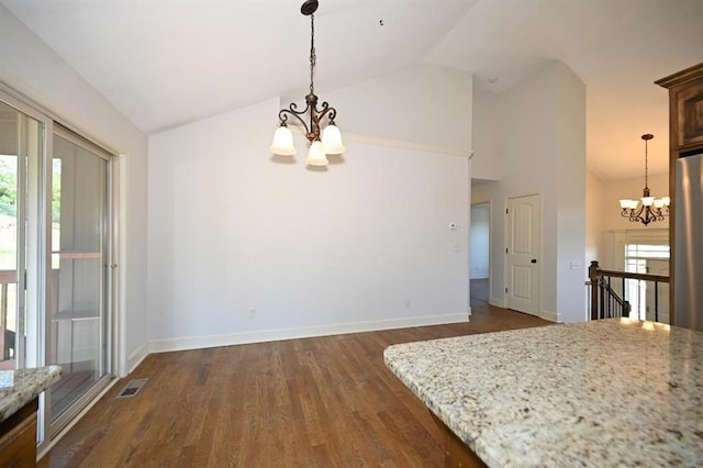 15790 NW 125th St, Platte City, MO 64079 - unfurnished dining area with a chandelier, vaulted ceiling, dark wood finished floors, and baseboards