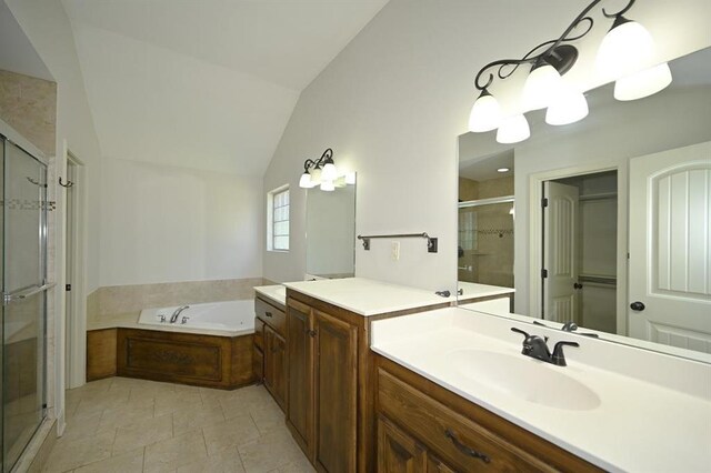 15790 NW 125th St, Platte City, MO 64079 - bathroom featuring a stall shower, lofted ceiling, a bath, vanity, and tile patterned floors