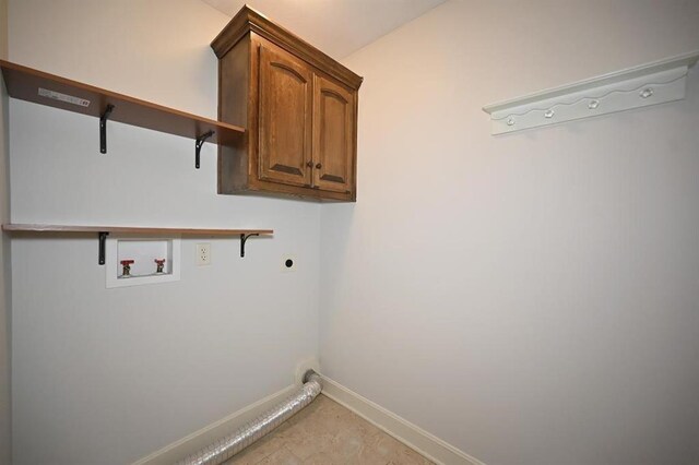 15790 NW 125th St, Platte City, MO 64079 - laundry room with hookup for an electric dryer, baseboards, washer hookup, and cabinet space