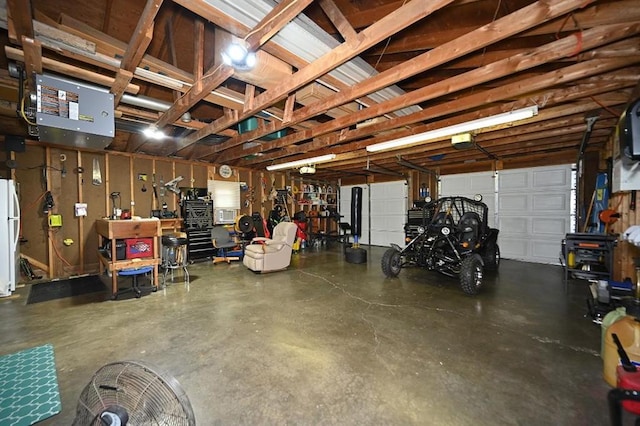 705 N Clark St, Edgerton, MO 64444 - garage featuring freestanding refrigerator