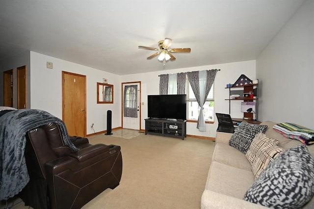 705 N Clark St, Edgerton, MO 64444 - carpeted living area featuring a ceiling fan and baseboards