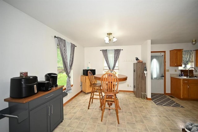 705 N Clark St, Edgerton, MO 64444 - dining space with baseboards