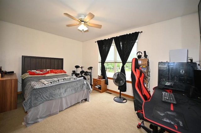 705 N Clark St, Edgerton, MO 64444 - carpeted bedroom featuring baseboards and ceiling fan