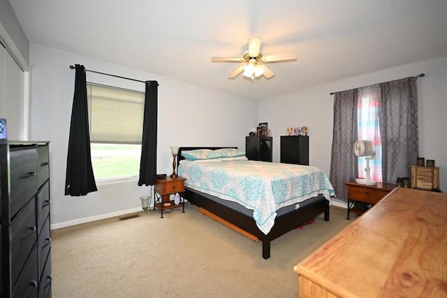 705 N Clark St, Edgerton, MO 64444 - bedroom featuring light colored carpet, baseboards, and a ceiling fan
