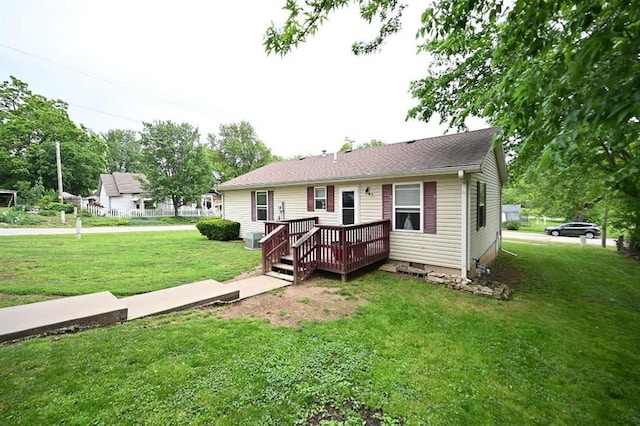 705 N Clark St, Edgerton, MO 64444 - ranch-style home with a wooden deck and a front yard