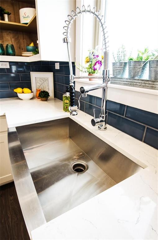 kitchen view of a sink and backsplash