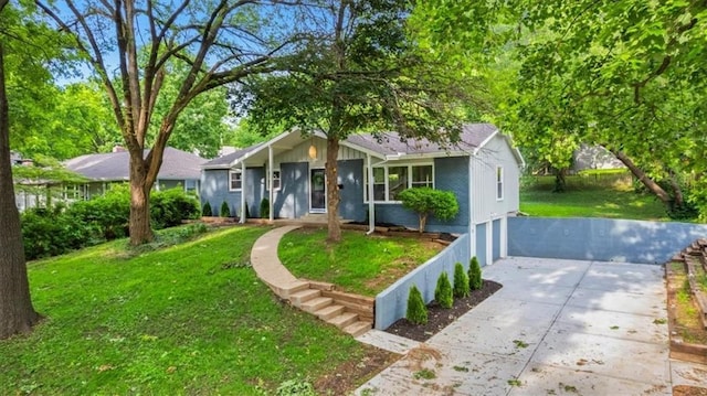 8741 Reeds Rd, Overland Park, KS 66207 - ranch-style home with a front yard and concrete driveway