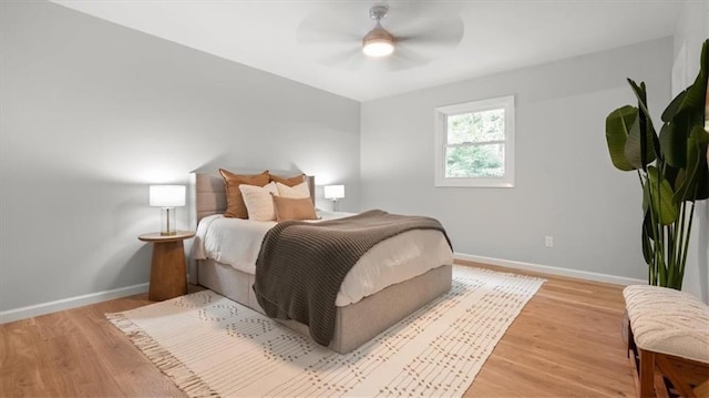 8741 Reeds Rd, Overland Park, KS 66207 - bedroom featuring baseboards, light wood finished floors, and a ceiling fan