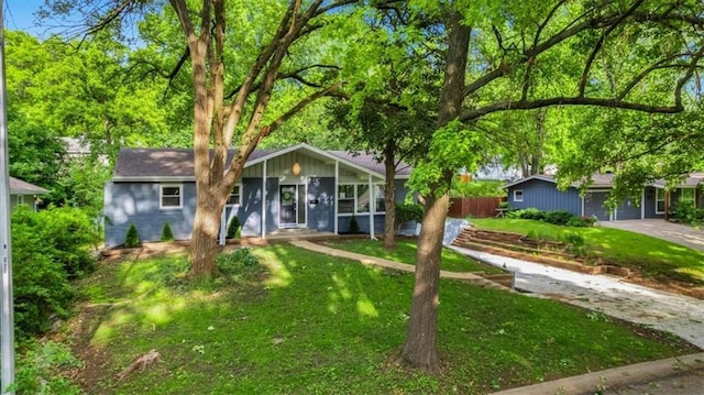 8741 Reeds Rd, Overland Park, KS 66207 - ranch-style house with concrete driveway and a garage