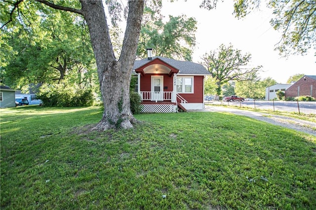 1340 S Osage St, Independence, MO 64055 - bungalow-style home featuring a front lawn
