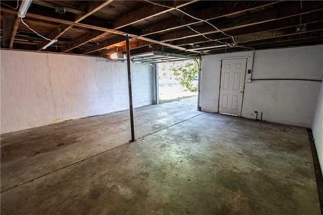 1340 S Osage St, Independence, MO 64055 - garage featuring concrete block wall