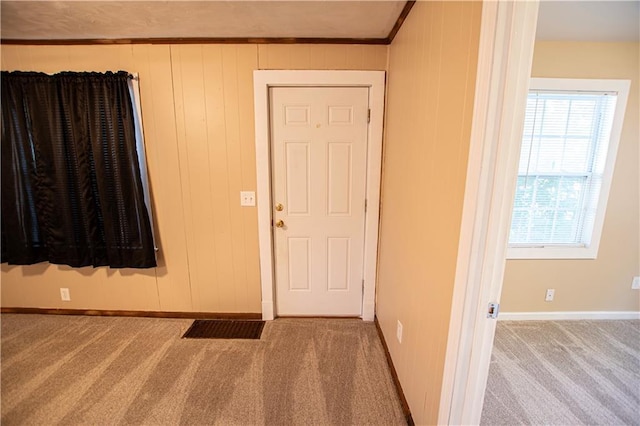 1340 S Osage St, Independence, MO 64055 - carpeted foyer with baseboards and crown molding