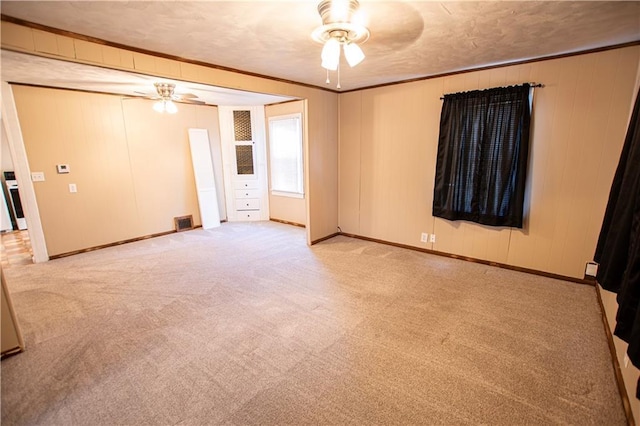1340 S Osage St, Independence, MO 64055 - unfurnished room with ceiling fan, carpet flooring, ornamental molding, and baseboards