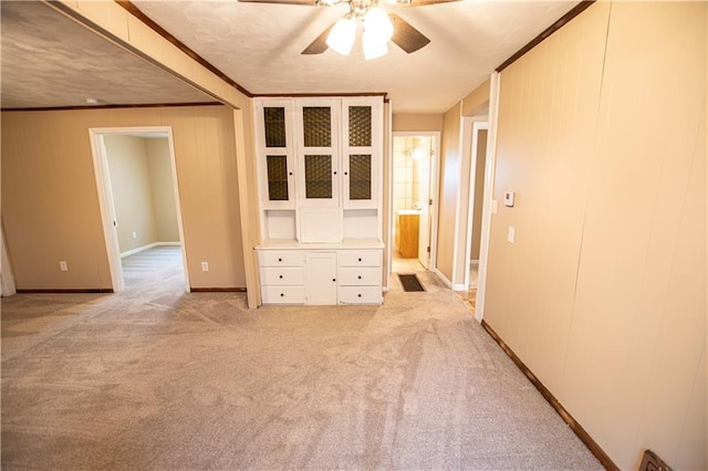 1340 S Osage St, Independence, MO 64055 - unfurnished room with a ceiling fan, light colored carpet, baseboards, and ornamental molding