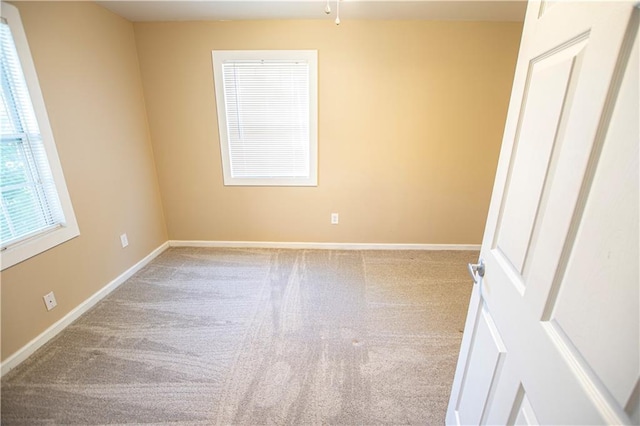 1340 S Osage St, Independence, MO 64055 - carpeted spare room featuring baseboards