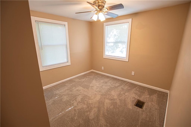 1340 S Osage St, Independence, MO 64055 - carpeted empty room with baseboards and ceiling fan