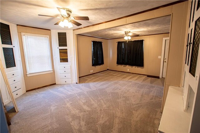 1340 S Osage St, Independence, MO 64055 - empty room featuring ceiling fan, carpet, baseboards, and crown molding