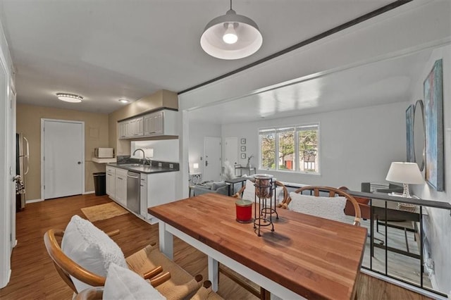 470 W 104th St Unit C, Kansas City, MO 64114 - dining space featuring wood finished floors