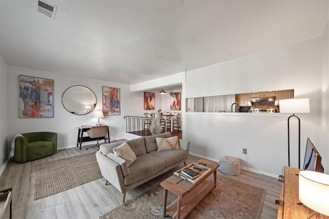 470 W 104th St Unit C, Kansas City, MO 64114 - living area with wood finished floors and baseboards