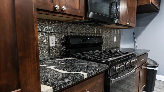 240 W 3rd Ave, Garnett, KS 66032 - kitchen featuring range with gas cooktop, backsplash, and dark brown cabinets