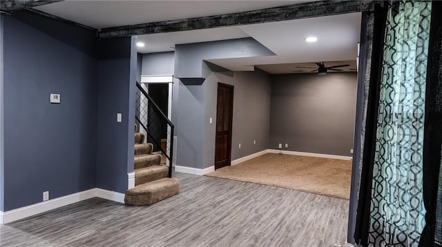 240 W 3rd Ave, Garnett, KS 66032 - basement with wood finished floors, baseboards, ceiling fan, stairs, and recessed lighting