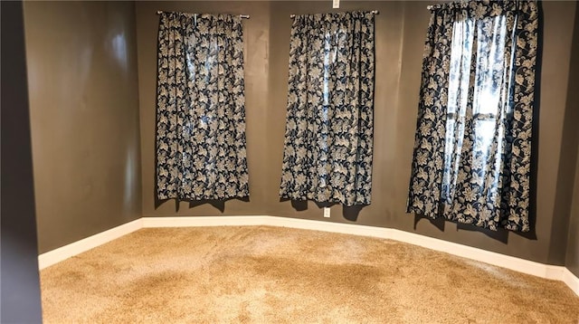 240 W 3rd Ave, Garnett, KS 66032 - carpeted spare room featuring baseboards