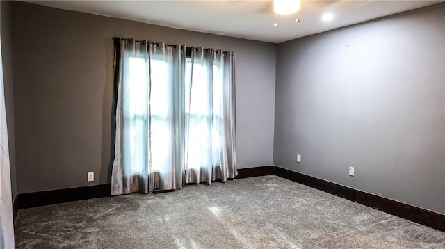 240 W 3rd Ave, Garnett, KS 66032 - unfurnished room with dark colored carpet and baseboards