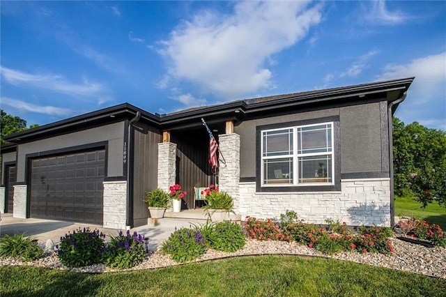 11809 E Ridgeview Ct, Peculiar, MO 64078 - view of front of property featuring stone siding, a garage, and driveway