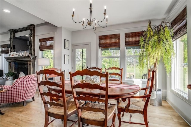 11809 E Ridgeview Ct, Peculiar, MO 64078 - dining space featuring healthy amount of natural light, light wood-type flooring, a chandelier, and recessed lighting