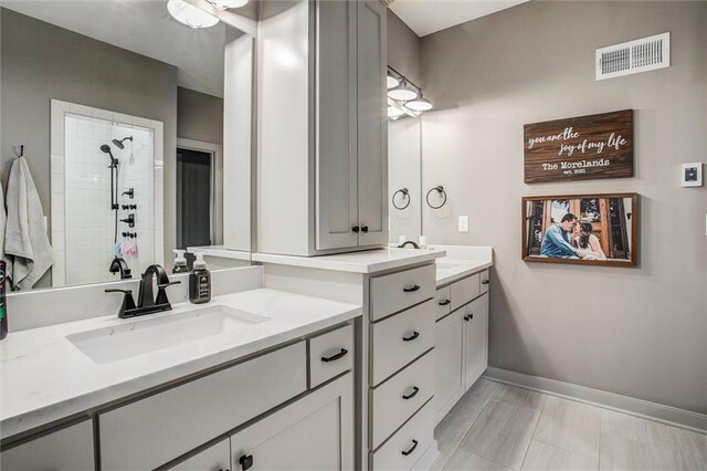11809 E Ridgeview Ct, Peculiar, MO 64078 - full bath with baseboards, two vanities, and a tile shower