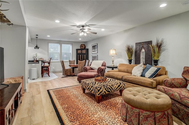 11809 E Ridgeview Ct, Peculiar, MO 64078 - living room featuring a ceiling fan, recessed lighting, and light wood finished floors